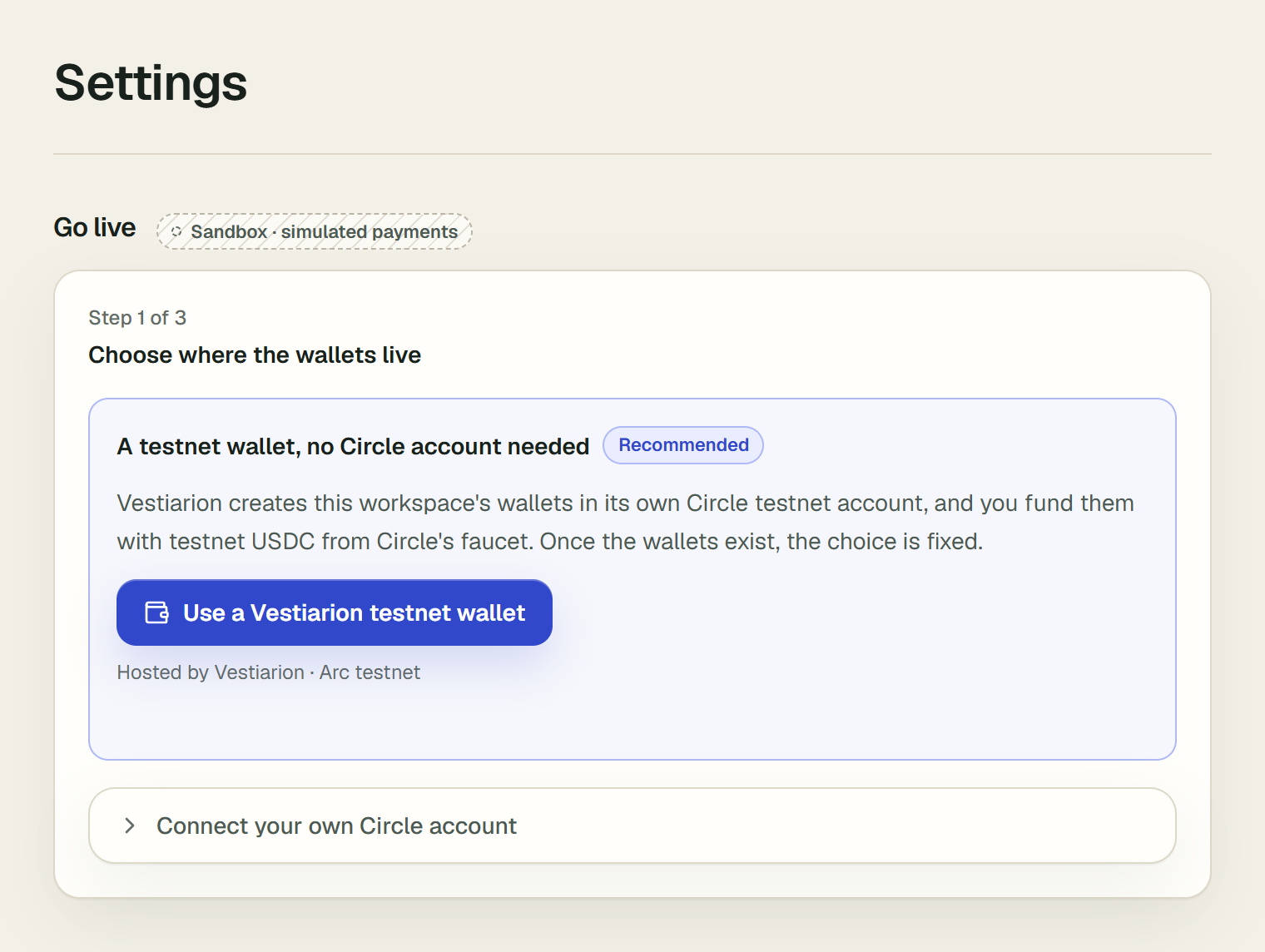 The Go live section of Settings at step 1 of 3, Choose where the wallets live. A box marked Recommended offers a testnet wallet with no Circle account needed, with the button Use a Vestiarion testnet wallet. Below it, a closed row reads Connect your own Circle account. The badge beside Go live reads Sandbox · simulated payments.