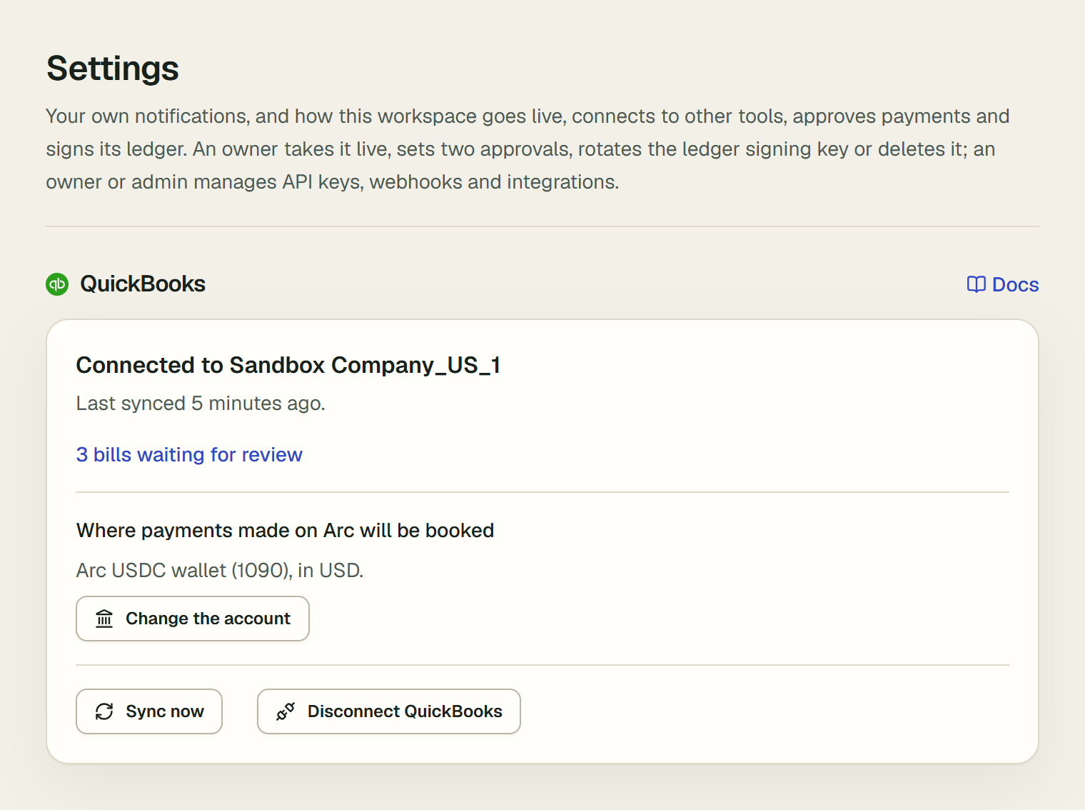 The QuickBooks card in Settings: Connected to Sandbox Company_US_1, last synced 5 minutes ago, a link saying 3 bills waiting for review, where payments made on Arc will be booked, Arc USDC wallet (1090) in USD, with Change the account, and the Sync now and Disconnect QuickBooks buttons.